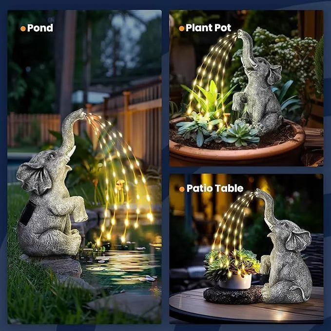 Grey resin elephant garden sculpture with solar panel and LED lights for outdoor decoration.