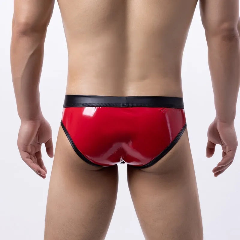 Gold metallic men's swim briefs with low waist and body-shaping design on a mannequin.