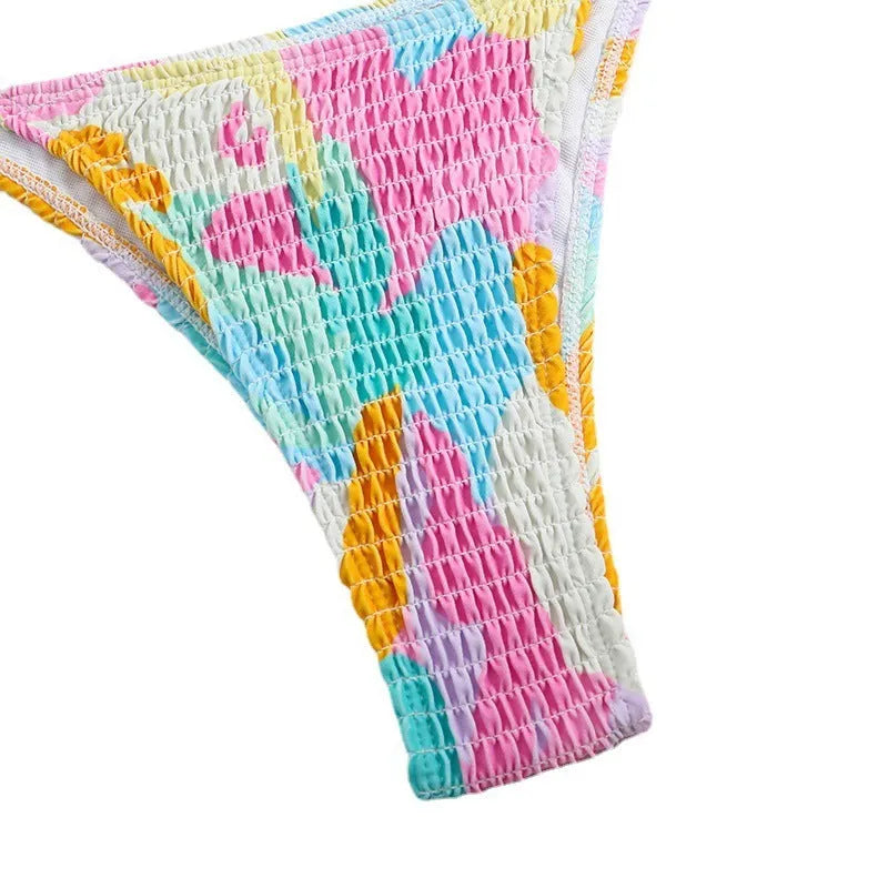 Women's floral print triangle bikini with smocking detail on the briefs, shown in multicolour.