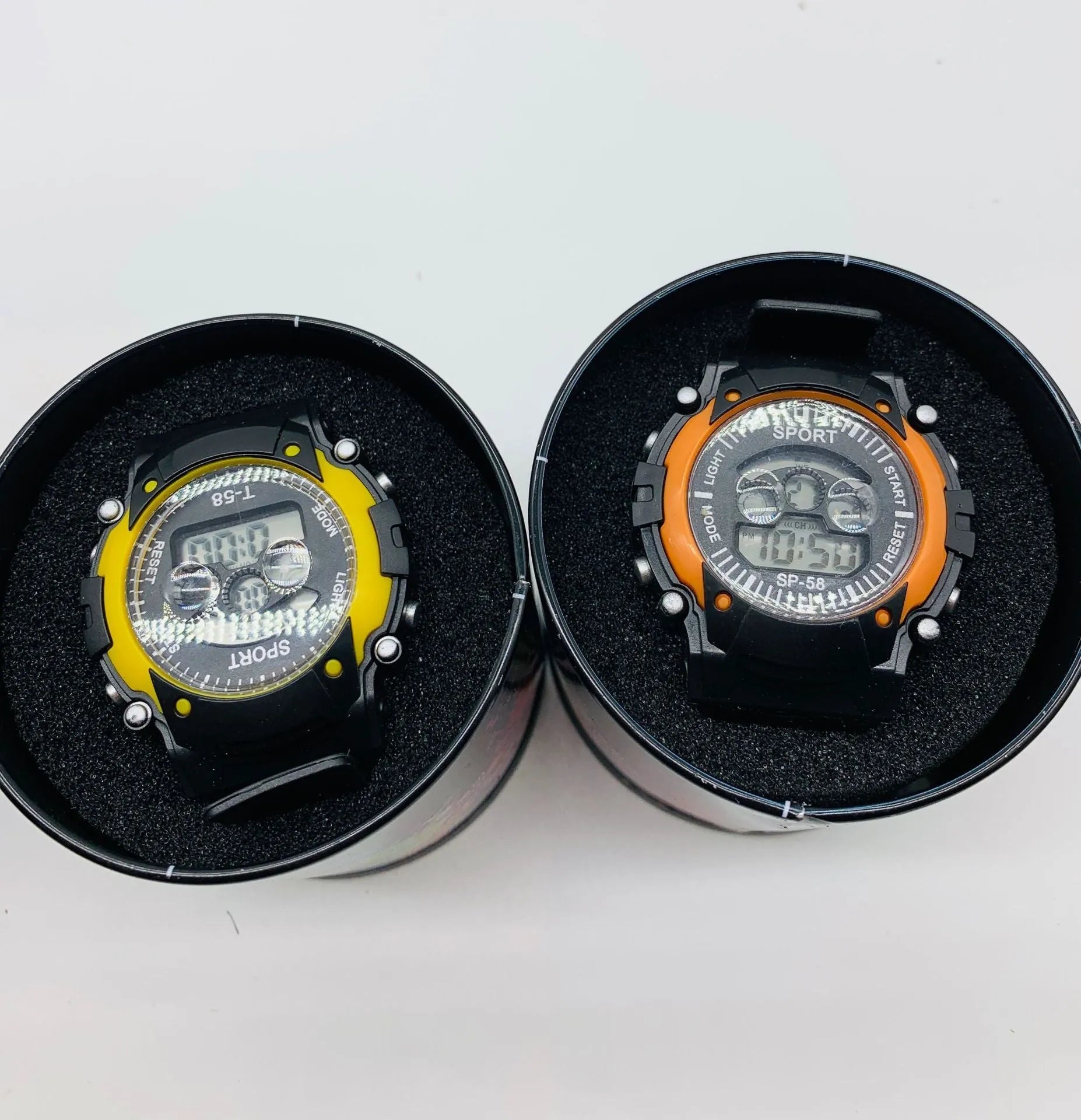 Children's digital sports watch with silicone strap and plastic case showing multiple functions including alarm and countdown timer