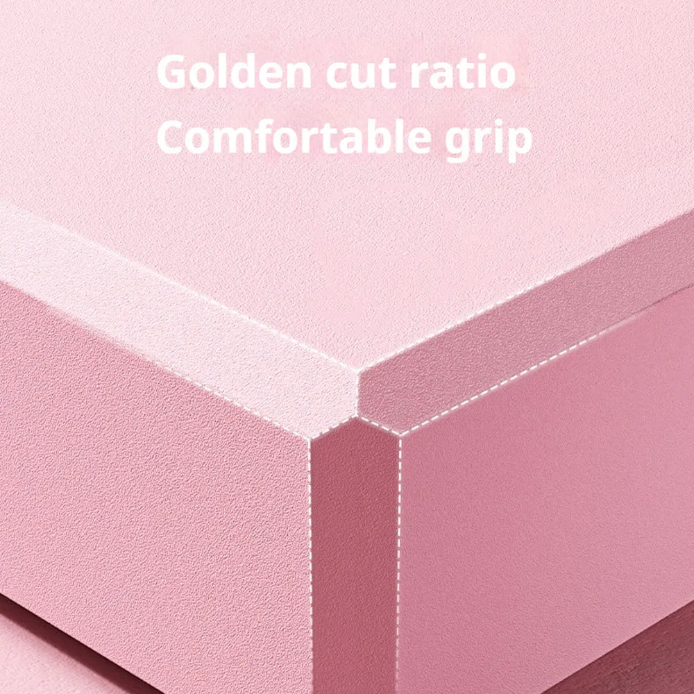 Solid colour EVA foam yoga block measuring 23cm long on a workout mat.