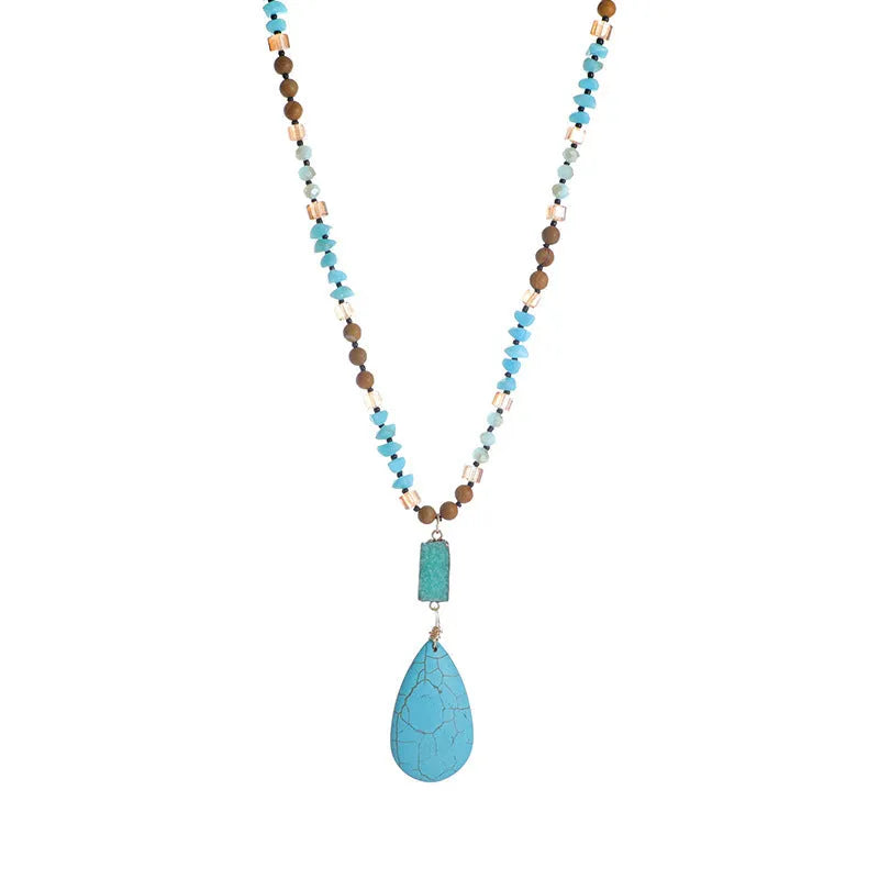 Blue turquoise gem inlaid drop pendant on a long ball bead necklace chain