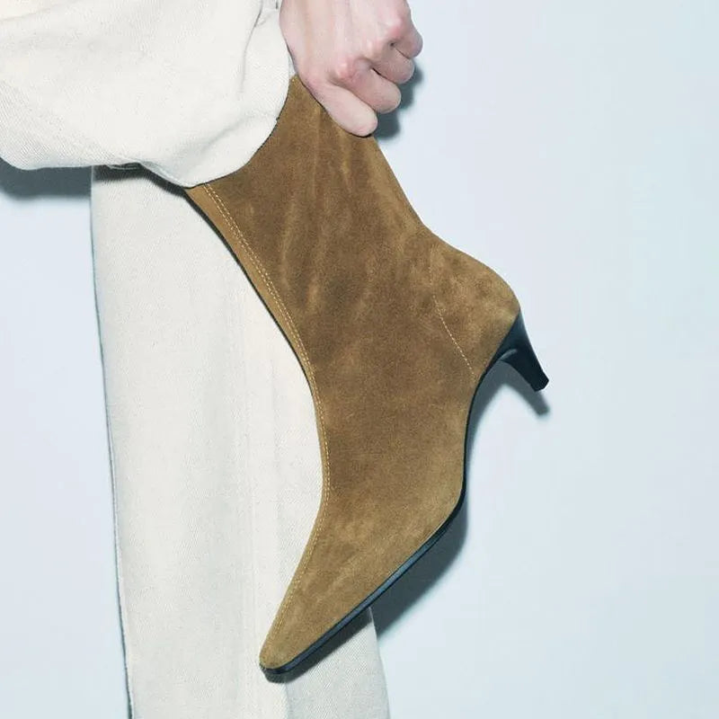 Brown square toe retro ankle boots with a side zip and a kitten heel on a waterproof platform sole.