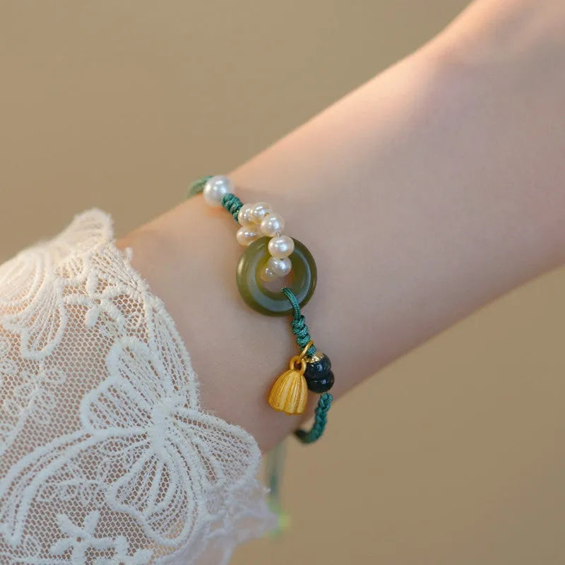 Hand-woven flexible wire watch band with a pearl peace buckle closure