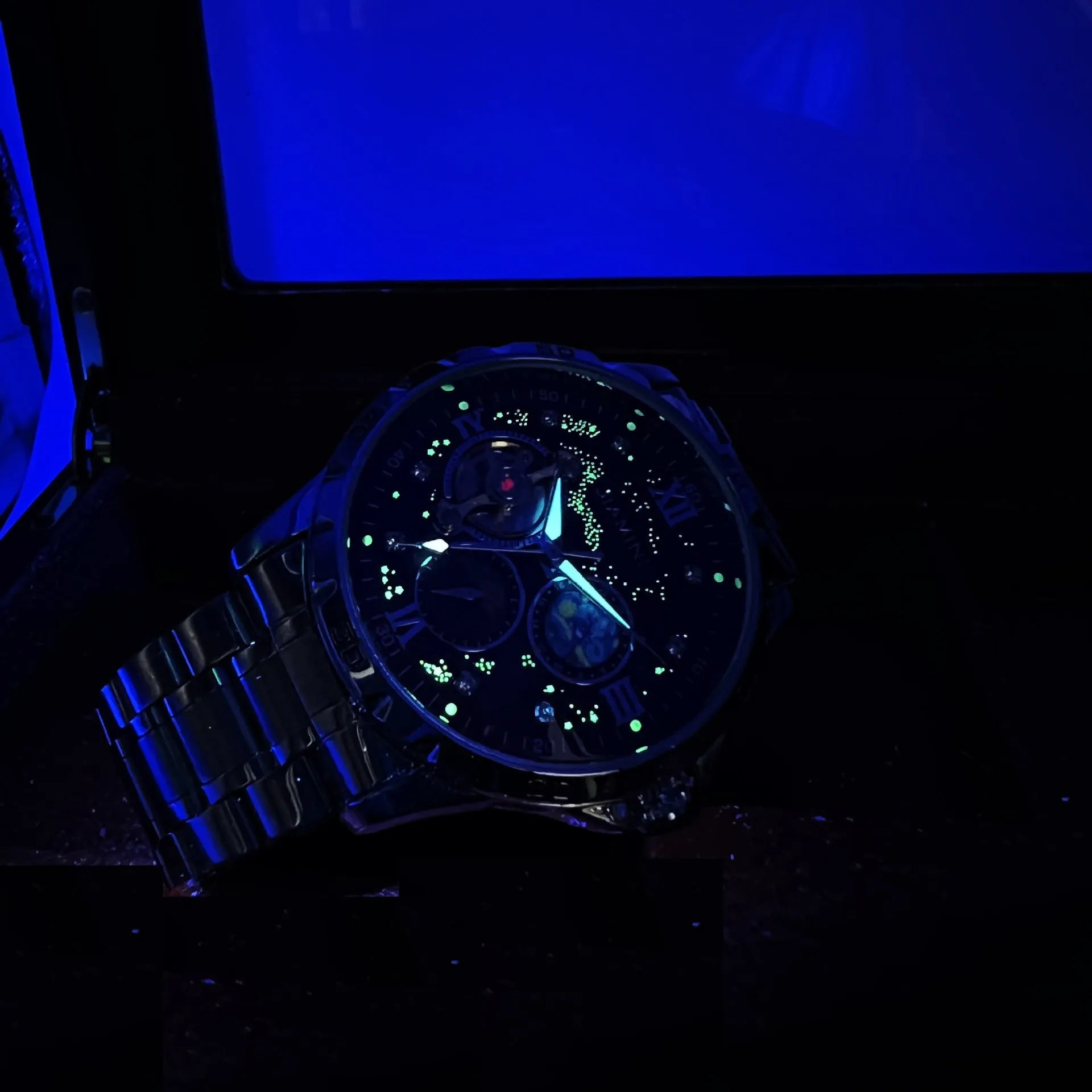 Men's automatic mechanical watch with large dial, rose gold case, and black face.