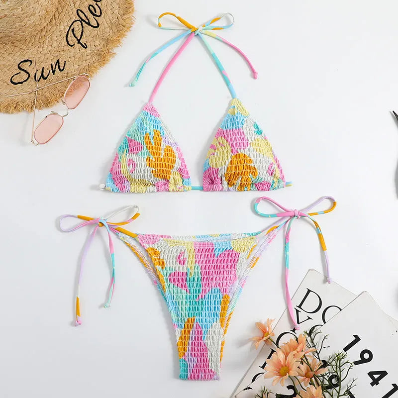 Women's floral print triangle bikini with smocking detail on the briefs, shown in multicolour.