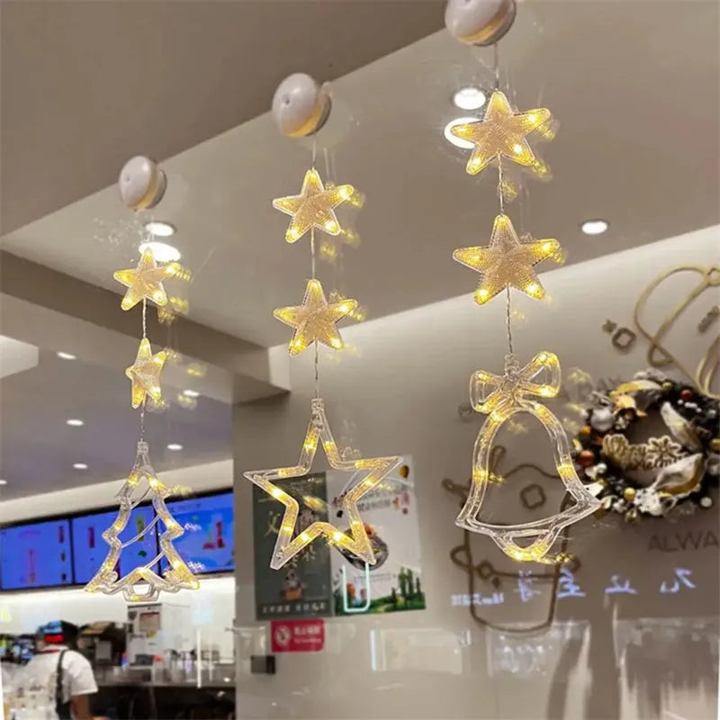 Set of three battery-powered LED Christmas pendant lights with suction cups, showing star, tree, and deer designs.