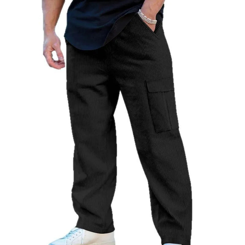 Men's navy blue corduroy cargo trousers with a straight loose leg and a drawstring waist, laid flat.