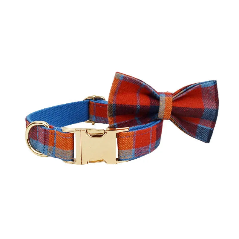 Blue plaid cloth dog collar with attached hand holding rope on adjustable size settings