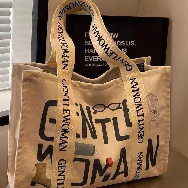 Large canvas tote bag with printed design options for travel and shopping