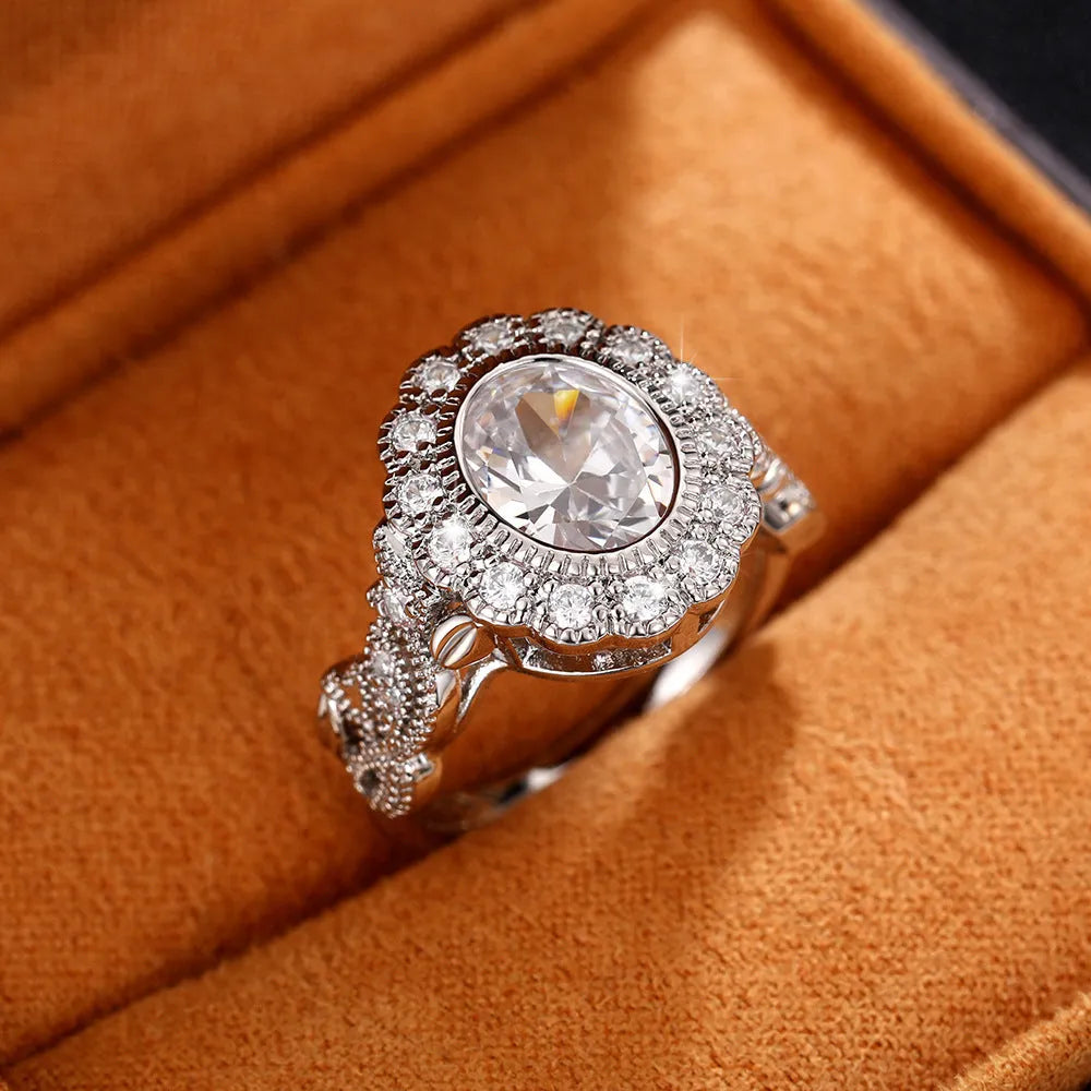 Geometric white gold plated copper ring with round zircon centrepiece on finger
