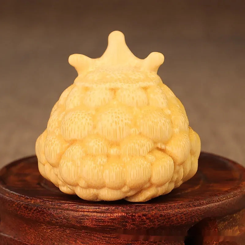 Solid bamboo carving of a Crown Princess toad ornament with live eye detail in a cute style.