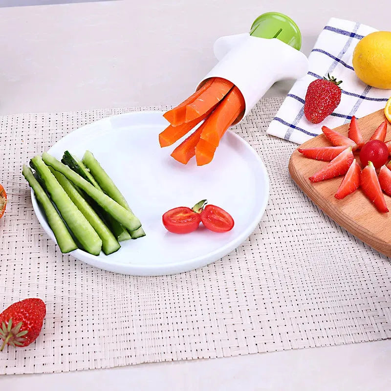 White kitchen vegetable and fruit slicer with multiple stainless steel blades.