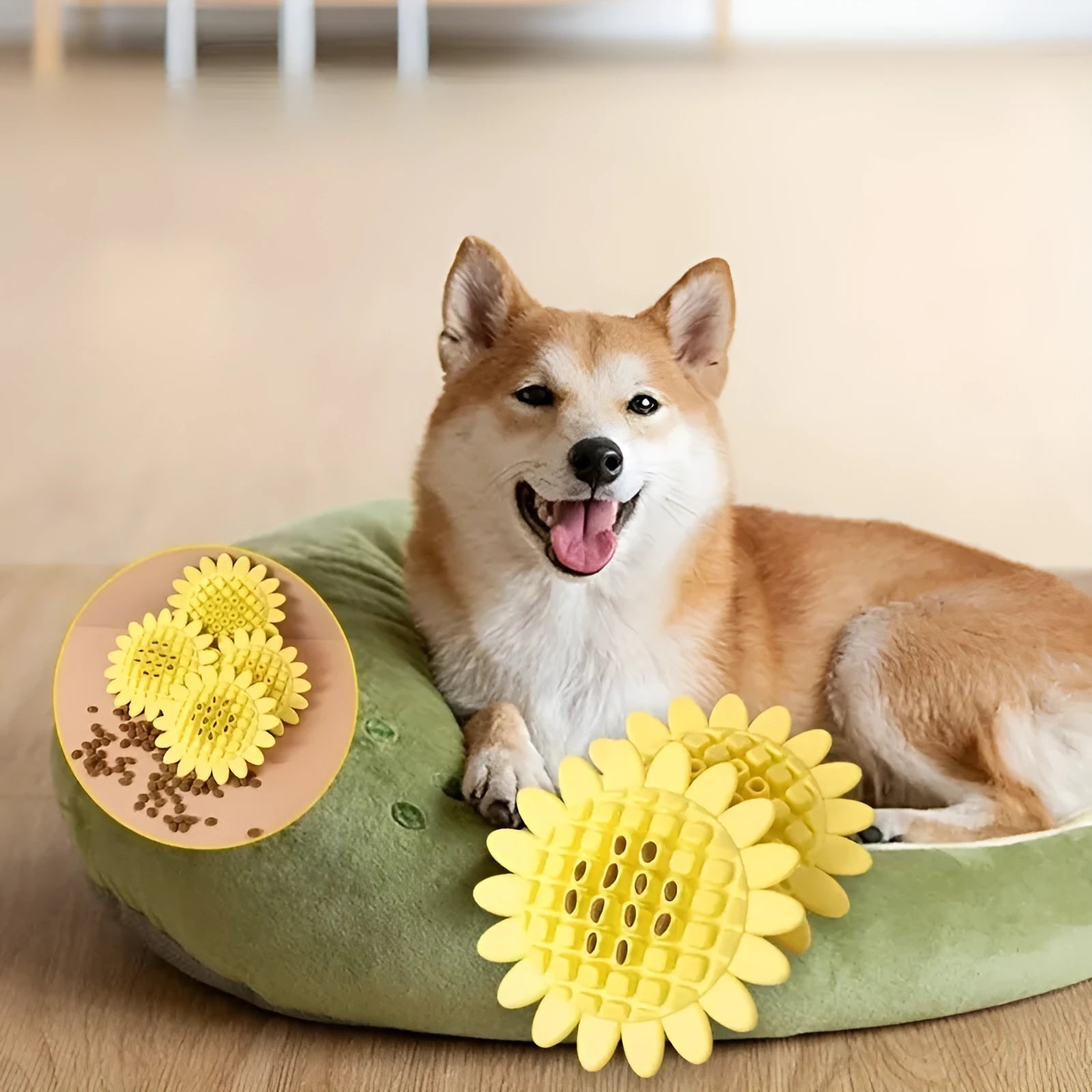 Yellow rubber sunflower dog chew toy with green stem, shown on a white background.