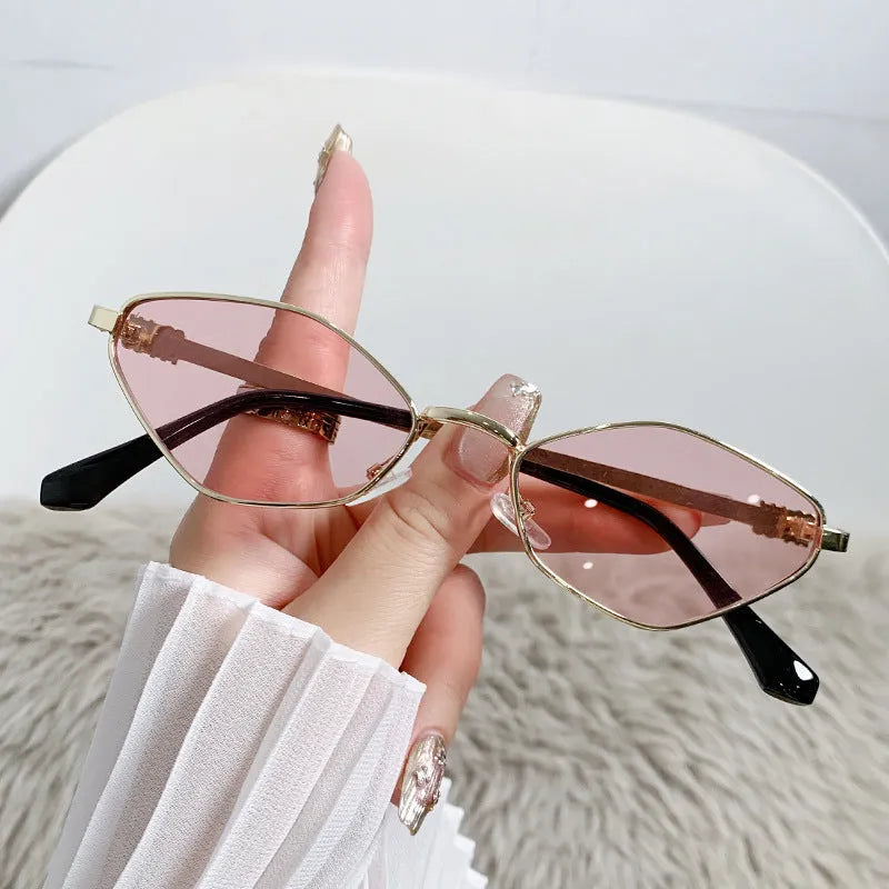 Gold metal small frame rhombus cat eye sunglasses with coloured lenses.