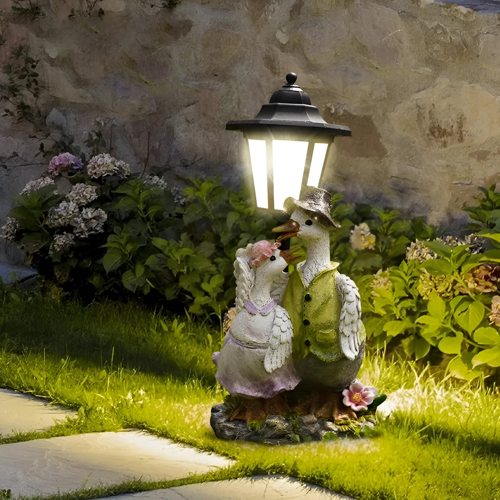 Hexagonal solar garden lamp with animal sculpture decoration in outdoor setting