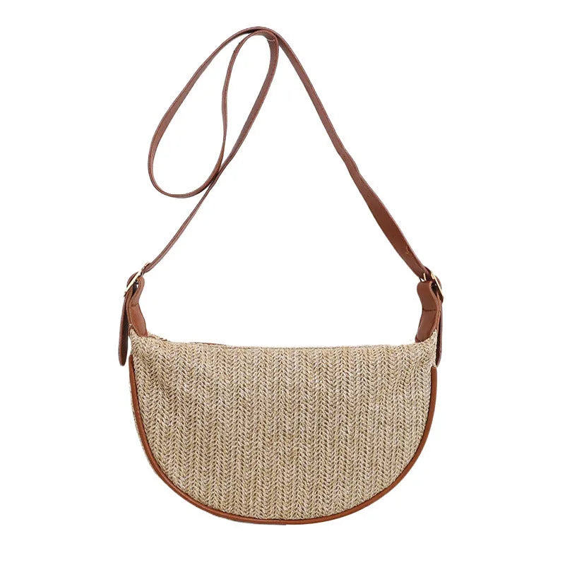 Women's woven straw crossbody bag showing internal phone pocket and document compartment
