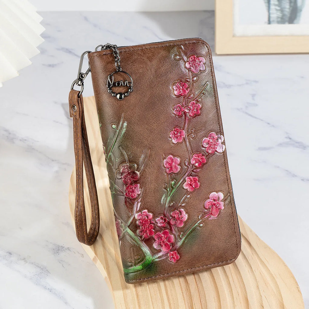 Embossed floral handbag with retro styling and zipper closure