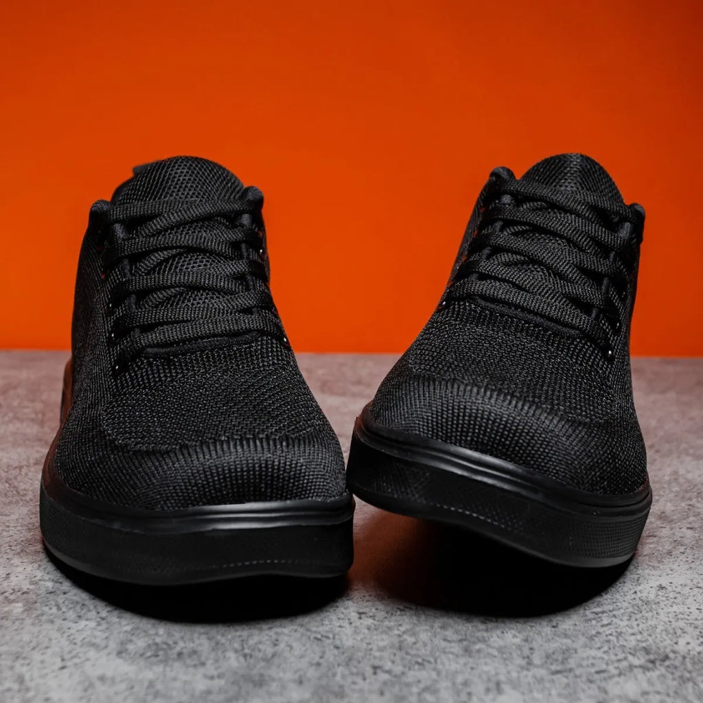 Light white thick sole casual sports shoes with mesh upper and lace-up front.