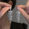 Silver pagoda colour Christmas tree drop earrings with zircon stones on copper stud setting.