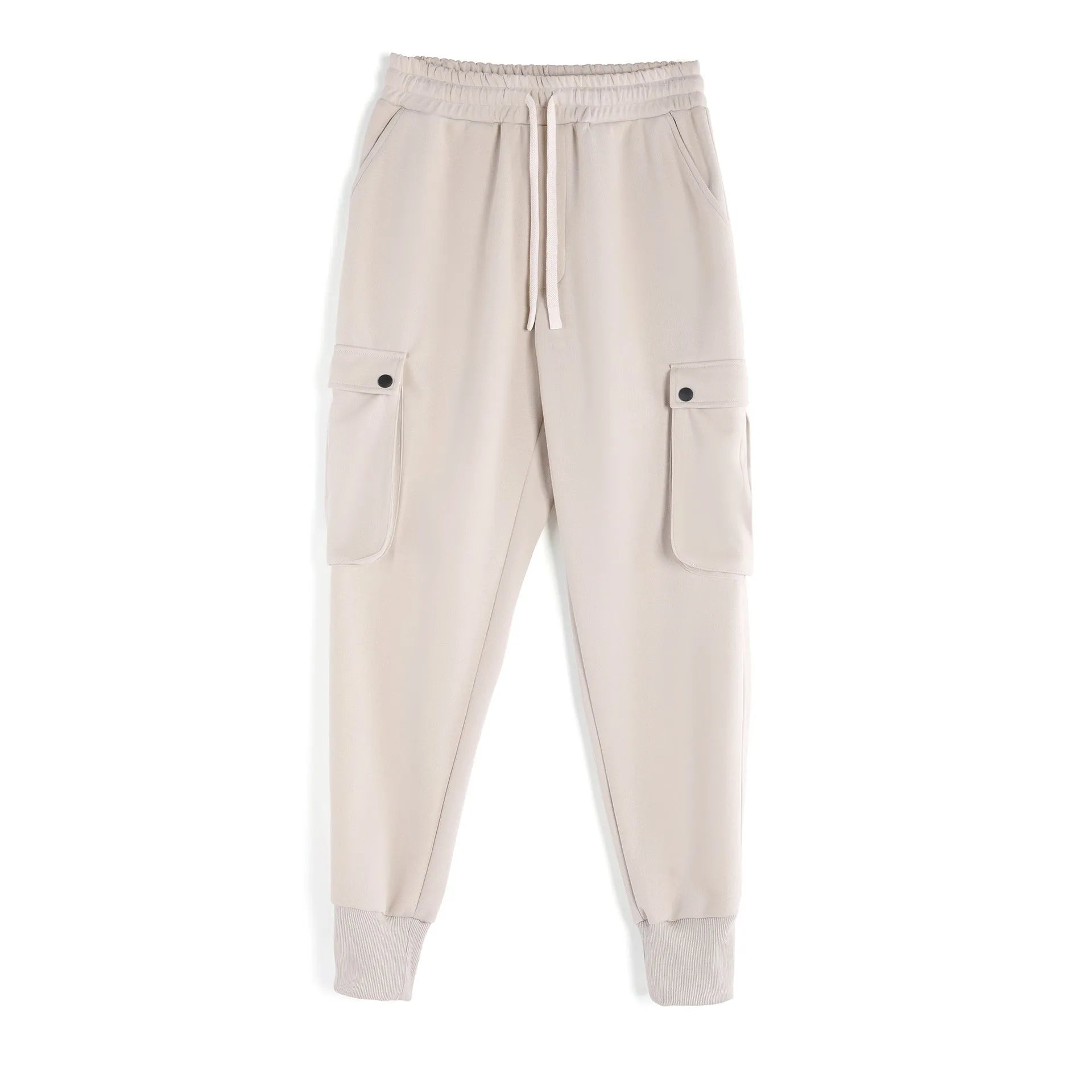 Men's loose-fit beige cotton sports trousers with ankle ties and side pockets laid flat.