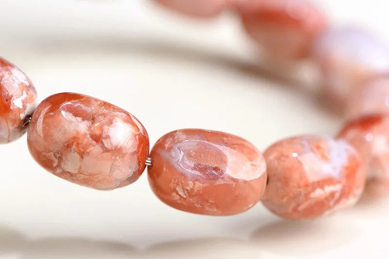 Natural cherry agate barrel bead bracelet with 10x14mm ruyi motifs geometric design