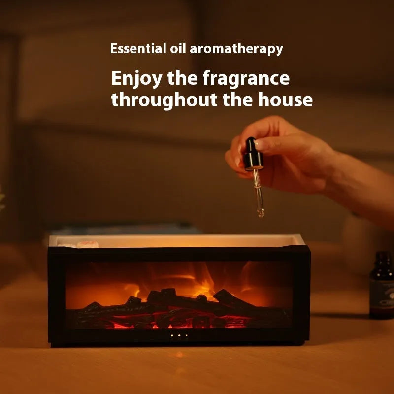 Square black flame effect aromatherapy diffuser with coloured LED lights and mist emitting, remote control beside it.