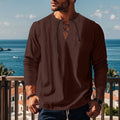 Men's loose fit solid colour cotton linen beach shirt on a hanger.