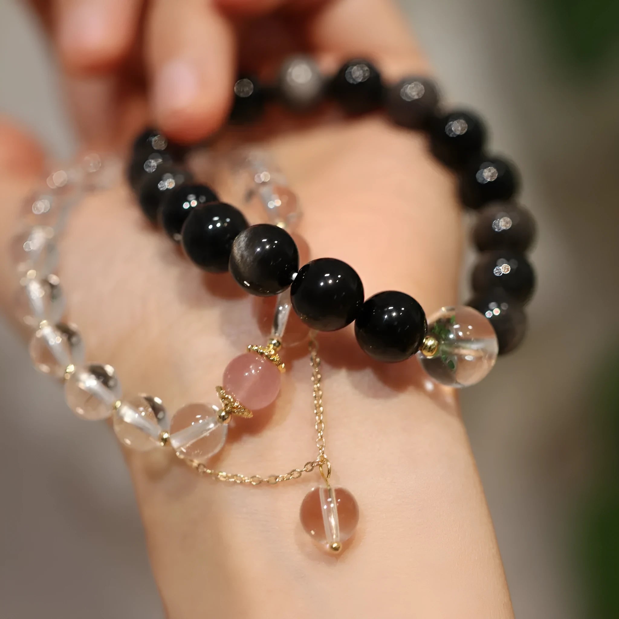 Chinese style geometric crystal bracelet with cat eye obsidian stone and auspicious patterns.