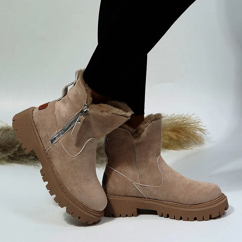 Women's black thick plush snow boot with side zipper and round toe on a rubber sole.