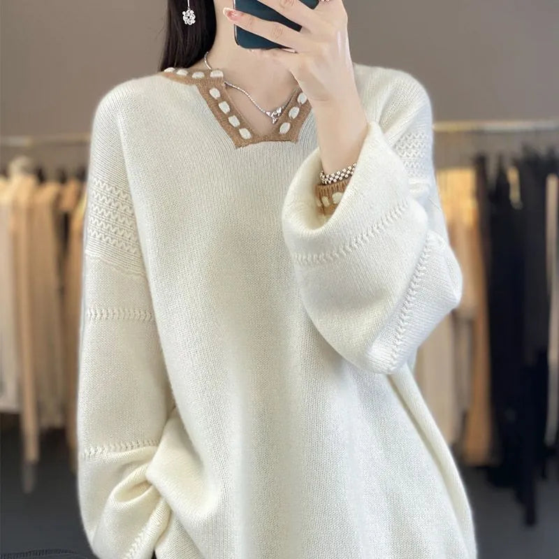 Women's white V-neck pullover sweater with regular long sleeves showing front view