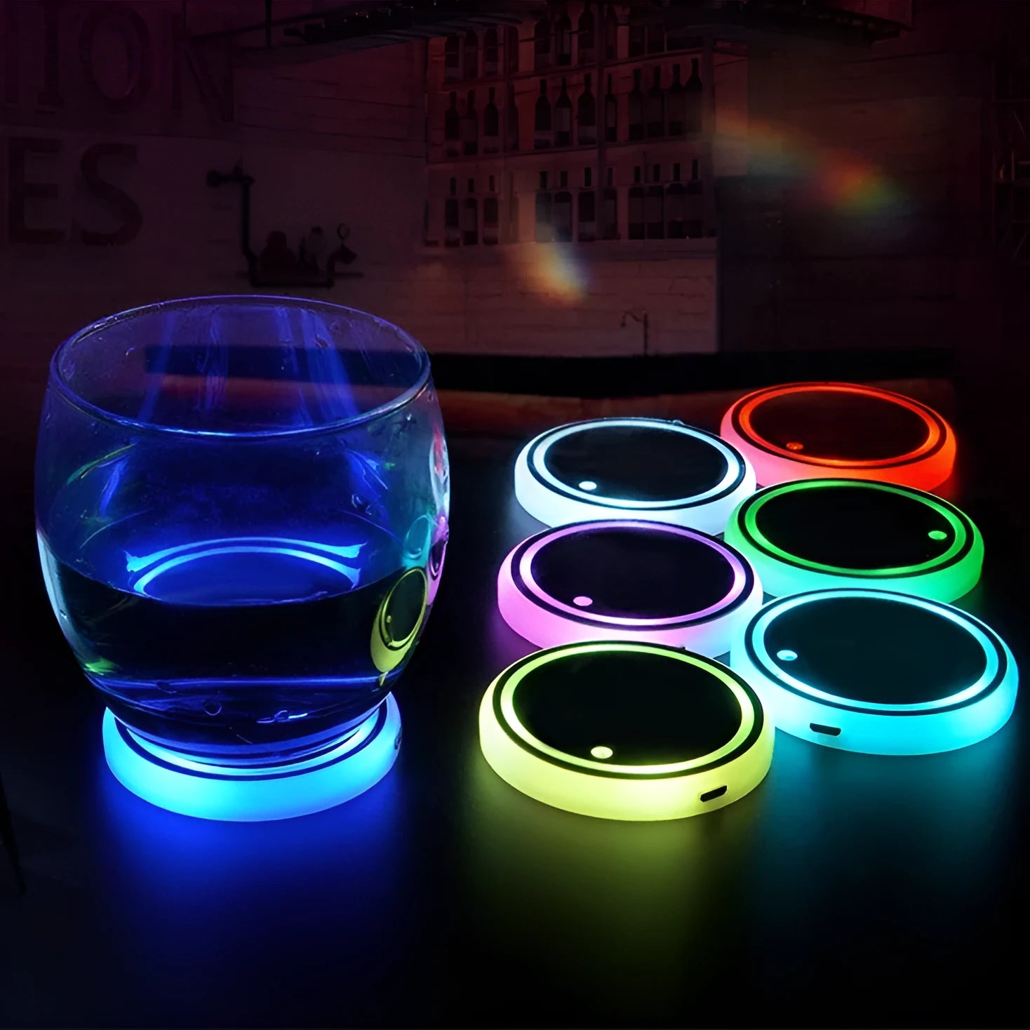 Colourful LED light-up car coaster in a vehicle cup holder, showing multiple light colours.