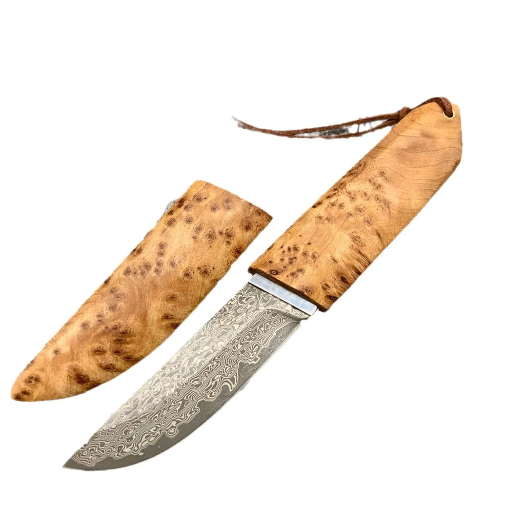 White Shadow Damascus steel short knife with Thuja wood handle, showing blade pattern.