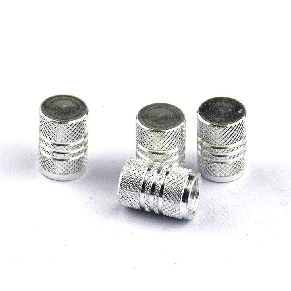 Set of coloured aluminium alloy car tyre valve caps in black, red, blue, gold, silver, green, purple, sky blue, grey, and orange