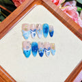 Blue plastic false nails with hand-painted carved summer ice transparent design in four sizes