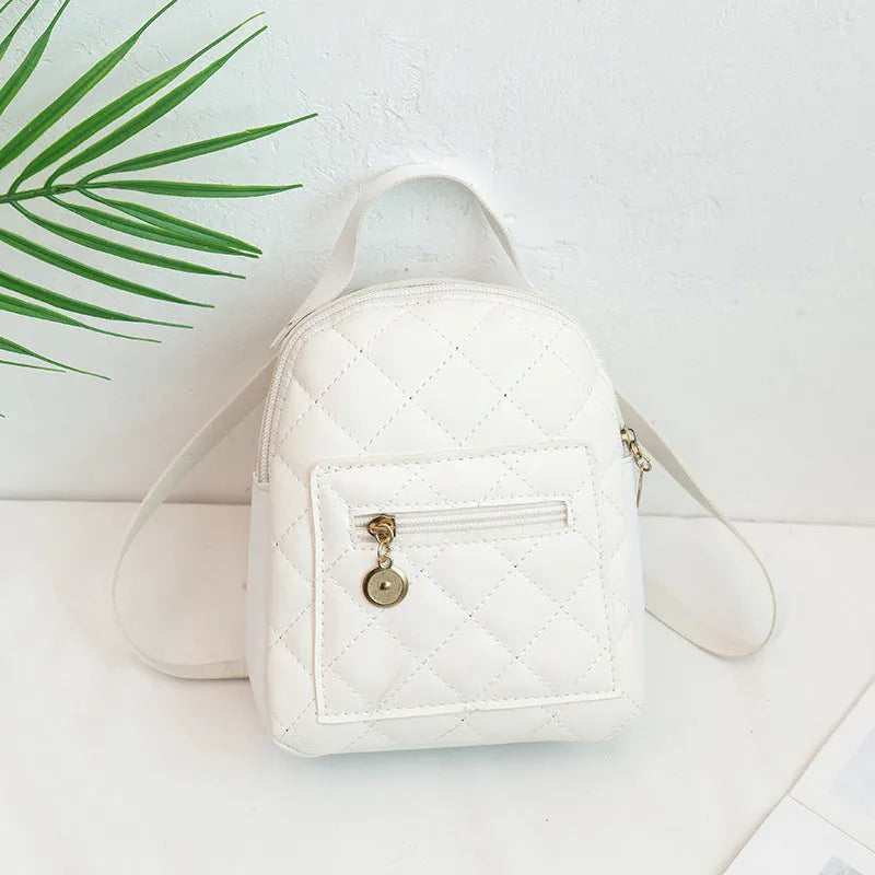 Girls' square hard PU backpack with embroidery, soft handle, in white, black, or pink.
