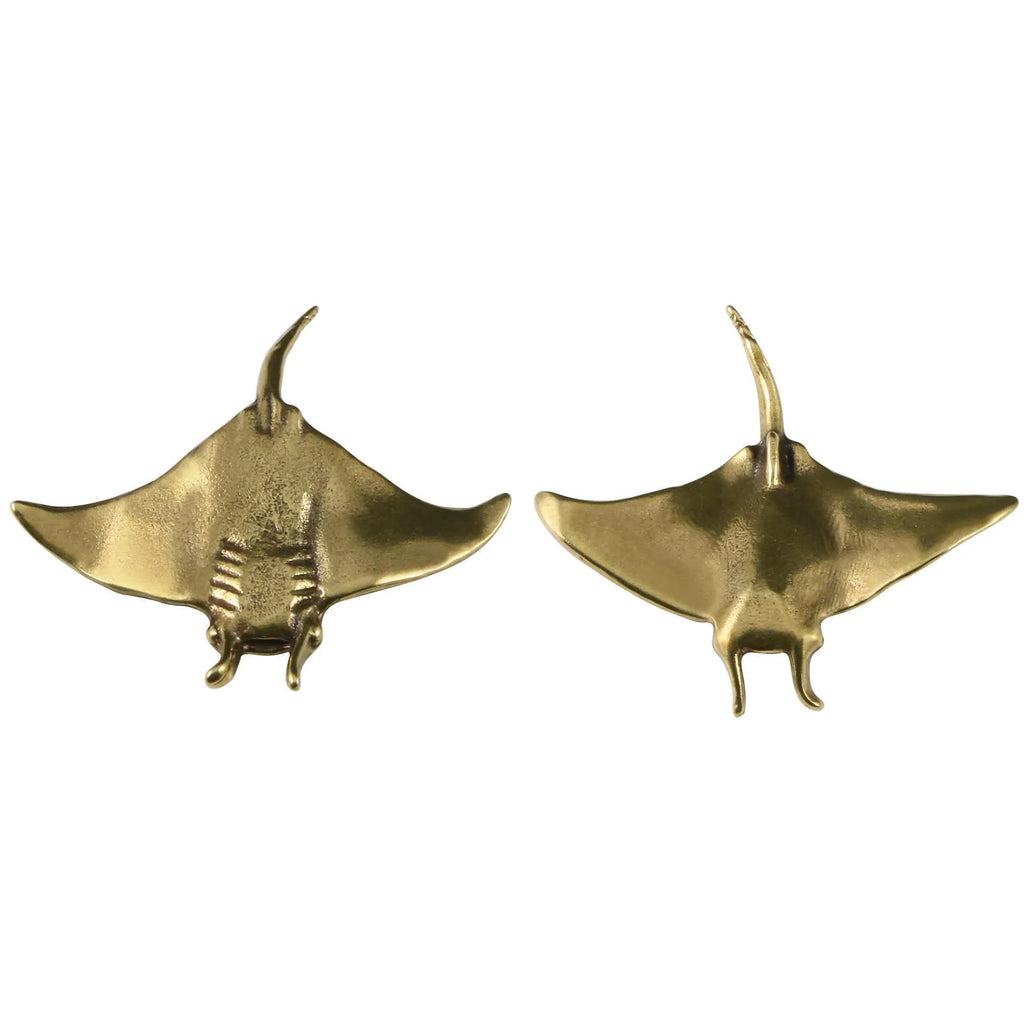 Brass devil fish ornament figurine on a surface, showing metallic colour and intricate devil fish design