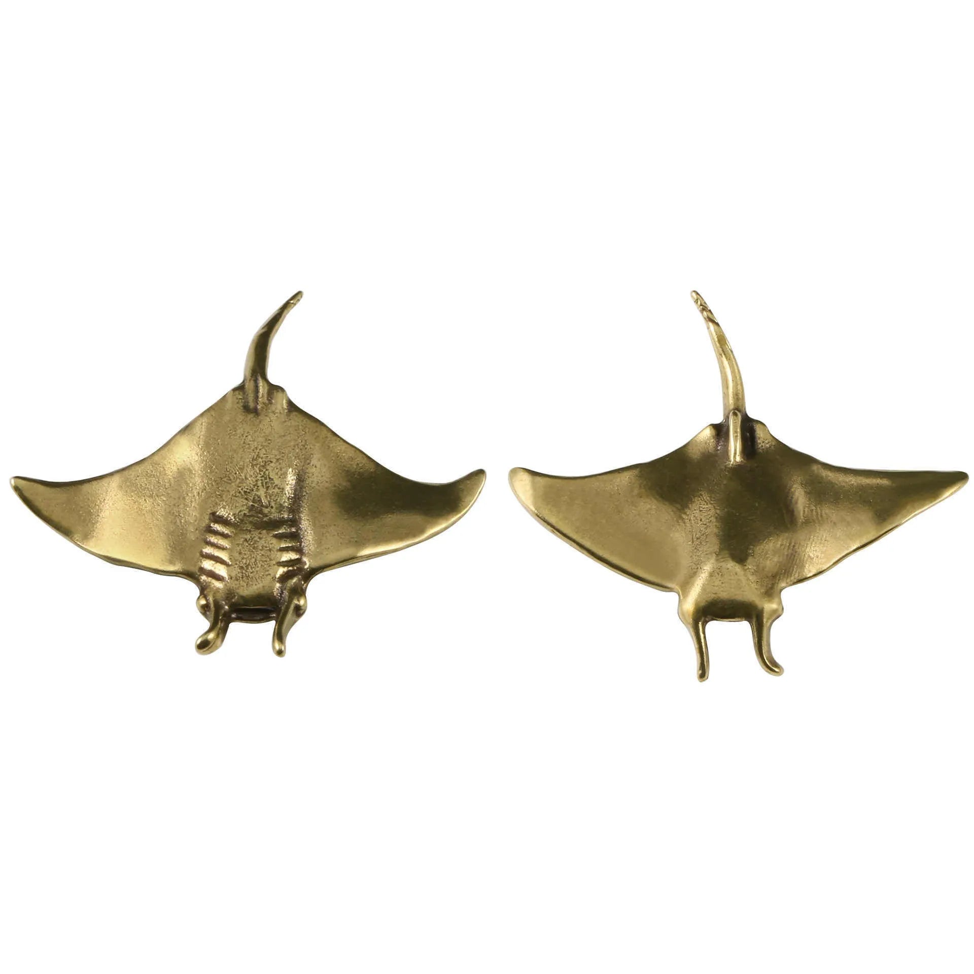Brass devil fish ornament figurine on a surface, showing metallic colour and intricate devil fish design
