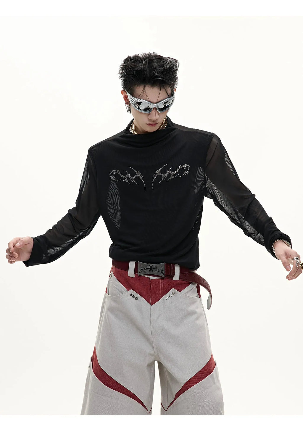 Man modelling a black slim-fit long sleeve mesh bottoming shirt with a textured ice-feel fabric.