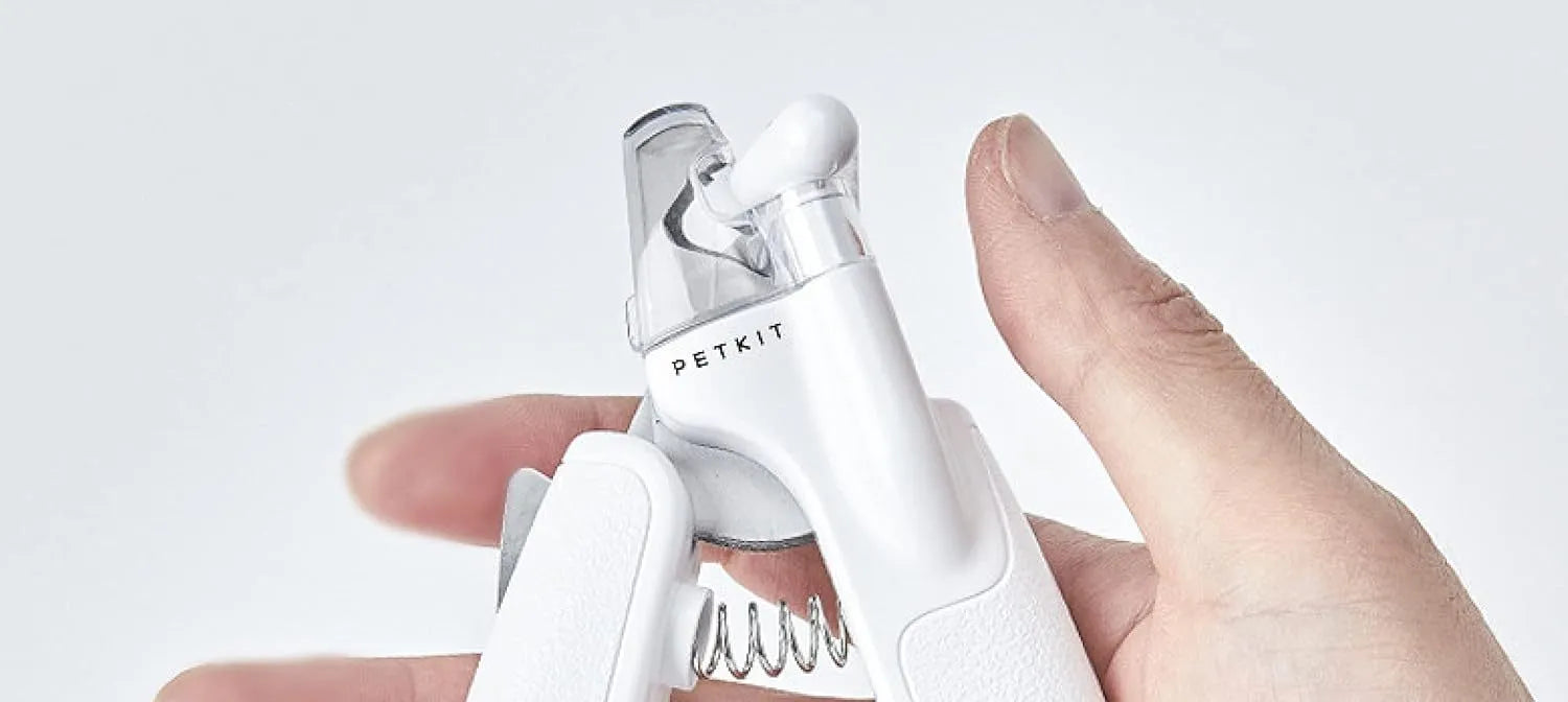 White pet nail clipper with LED light, transparent anti-splash guard, and leather-like handle