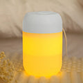 Small white cylindrical USB humidifier with aromatherapy function on desk