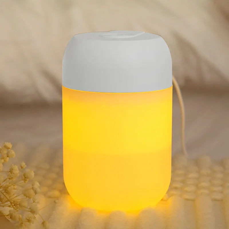 Small white cylindrical USB humidifier with aromatherapy function on desk