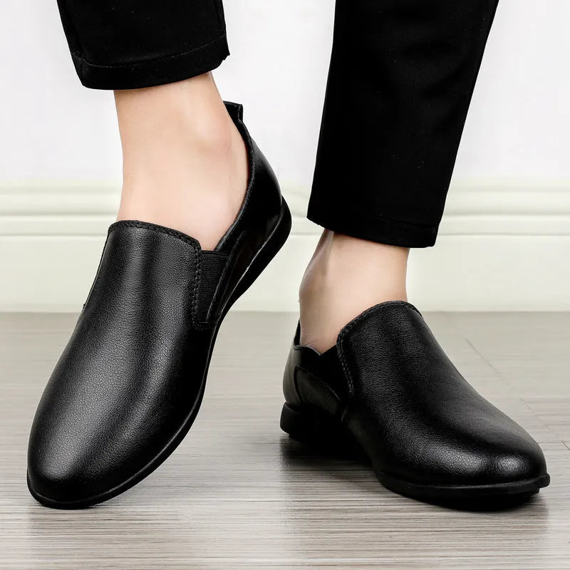 Men's black and brown leather shoes with round toe design for business casual wear.