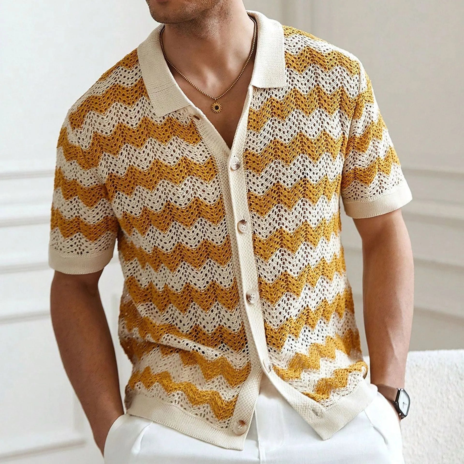 Men's blue short sleeve corrugated sweater with jacquard flocked texture on a hanger.
