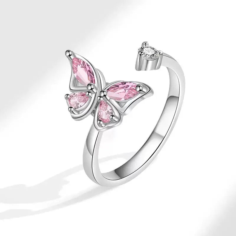 Butterfly adjustable ring with electroplated white gold finish and blue diamond accent on copper base
