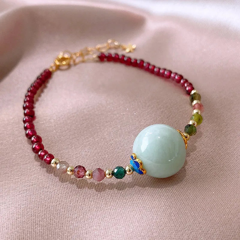Aquamarine Chinese style garnet coloured tourmaline bracelet with a drop shape.