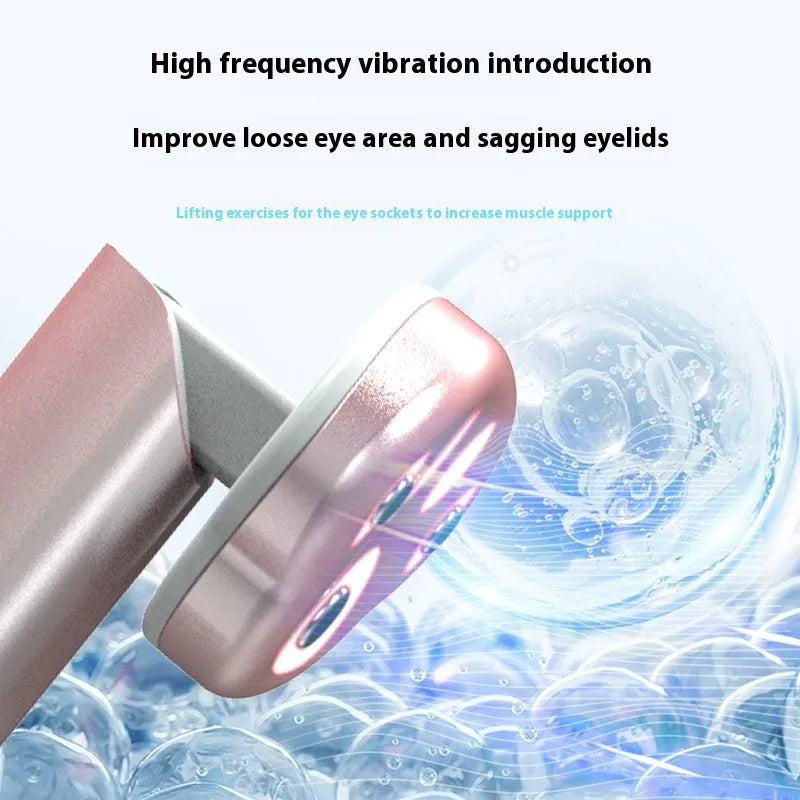 Cat's Paw design micro-current eye massager in gradient pink with LED light display.