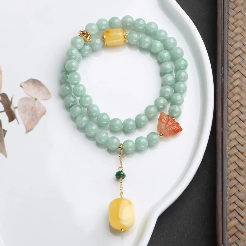 Double-layer women's bracelet with jade round beads and hanging beeswax barrel beads in retro geometry design
