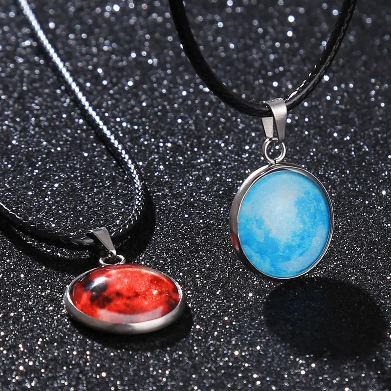 Close-up of a constellation design glass pendant on an alloy chain necklace with extension.