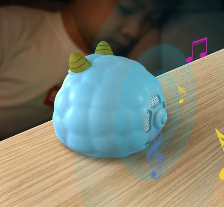 White Deer style smart alarm clock with luminous silicone dial on a bedside table